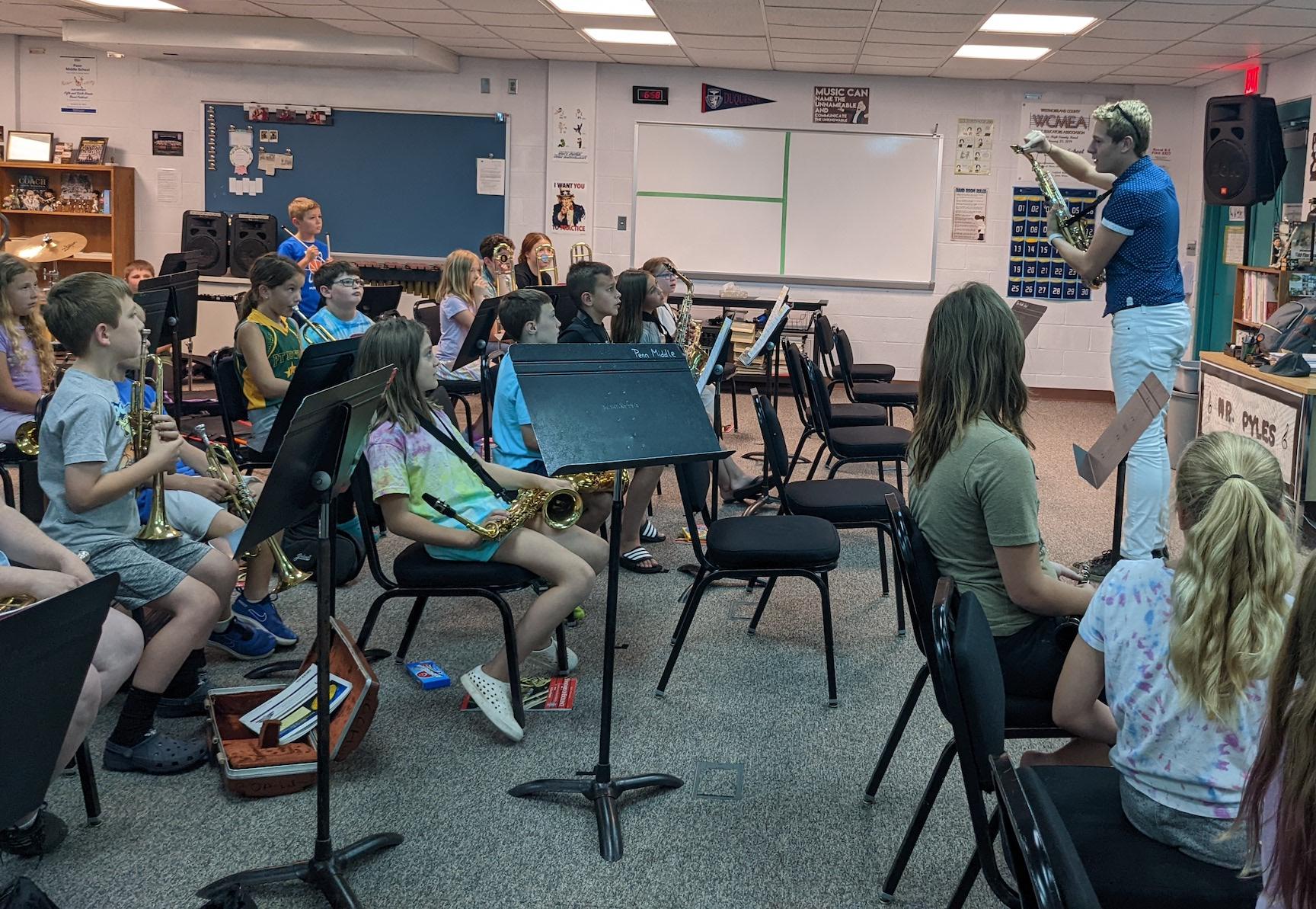 Beginner flute students work in a group 