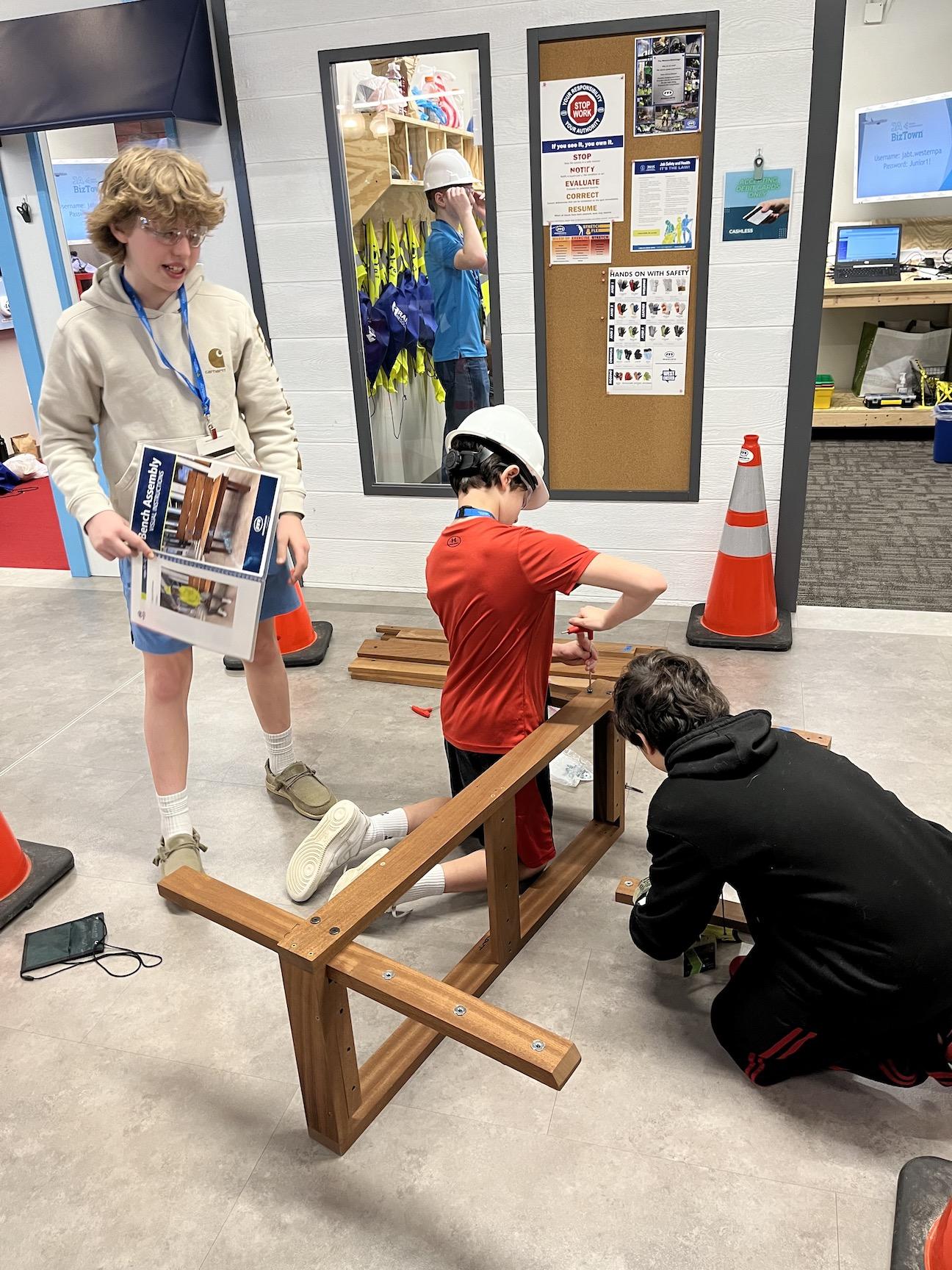 Students role play as Mascaro Construction workers: Brady Bianco, Antonio Caruso, and Jude Montano